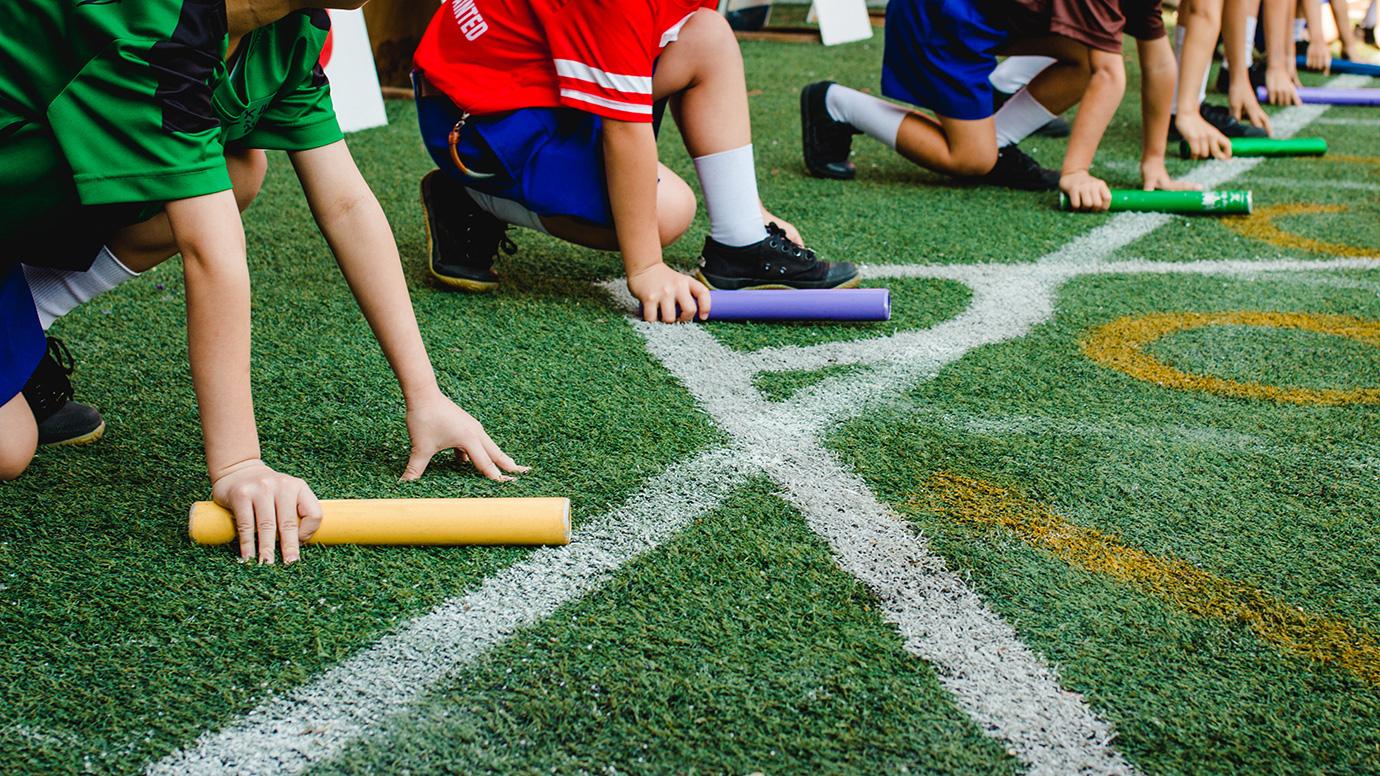 Students at the start of a school relay race