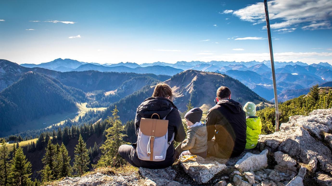 A family relaxing on a mountain hike