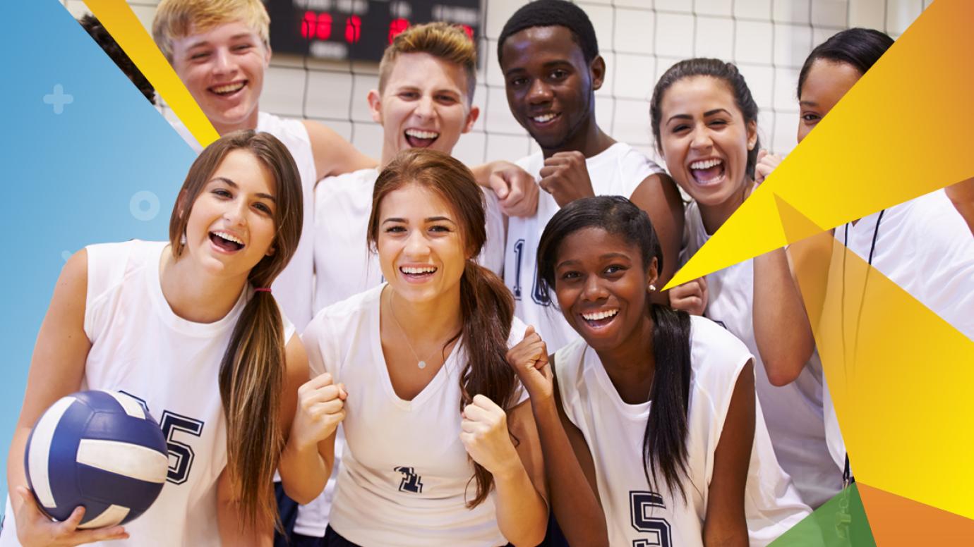 A group of smiling young volleyball players
