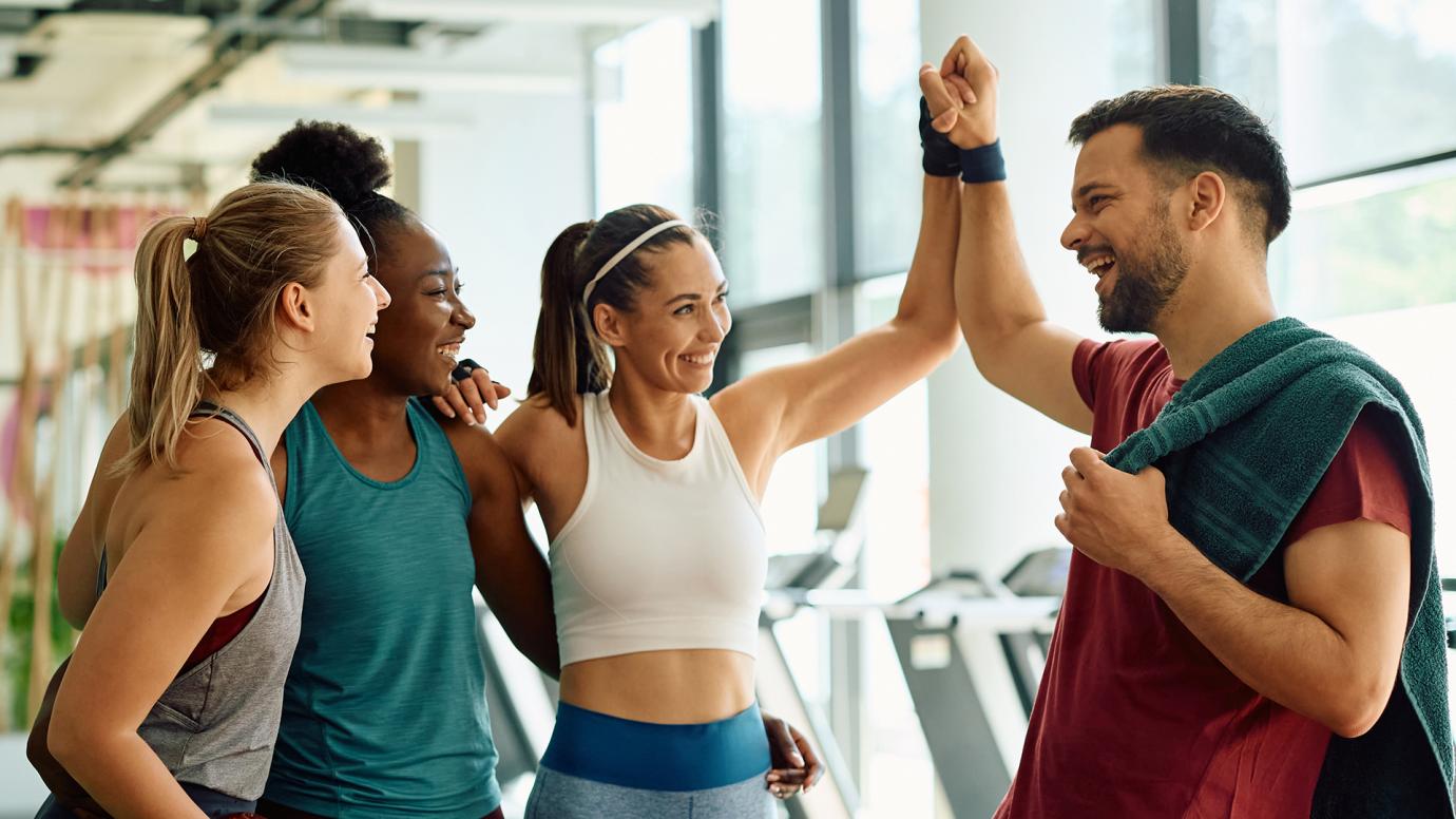 Group of people celebrating after a workout