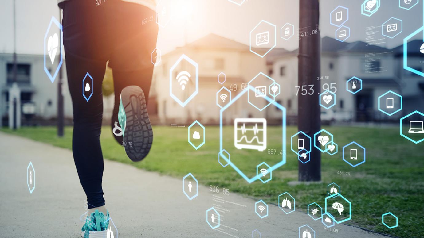 Picture of a runner at sunset with various tech symbols overlaid
